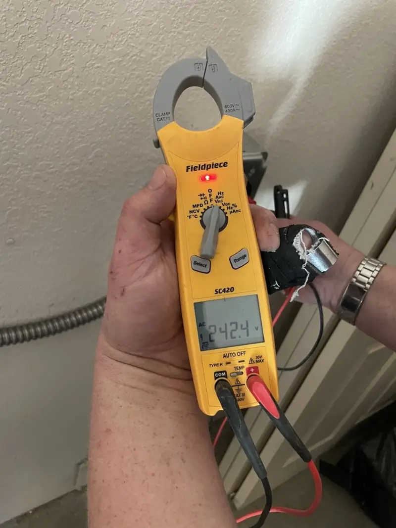 Voltage testing with clamp meter during Electrical Installation Services in Denver